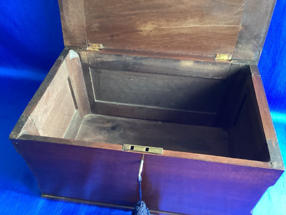A rectangular dark mahogany storage box featuring a hinged lid with moulded edges and a central keyhole. View VIII