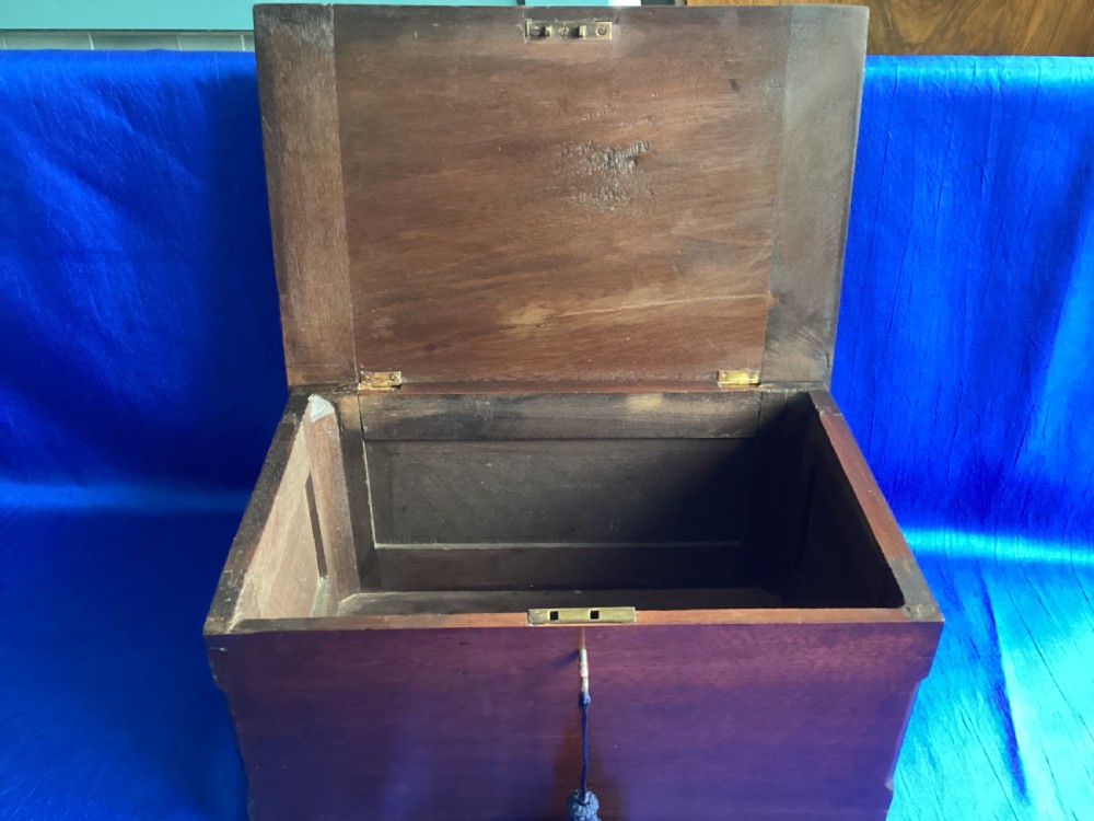 A rectangular dark mahogany storage box featuring a hinged lid with moulded edges and a central keyhole. View IX