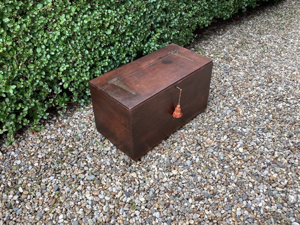 A rectangular dark mahogany wooden bible box featuring brass strap hinges on top and a keyhole with a decorative tassel on the front. View II
