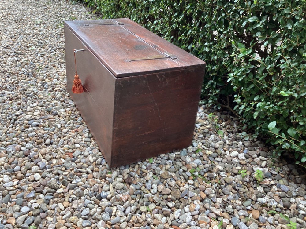 A rectangular dark mahogany wooden bible box featuring brass strap hinges on top and a keyhole with a decorative tassel on the front. View V
