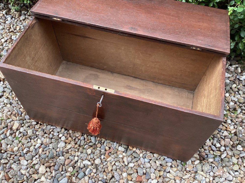 A rectangular dark mahogany wooden bible box featuring brass strap hinges on top and a keyhole with a decorative tassel on the front. View VI