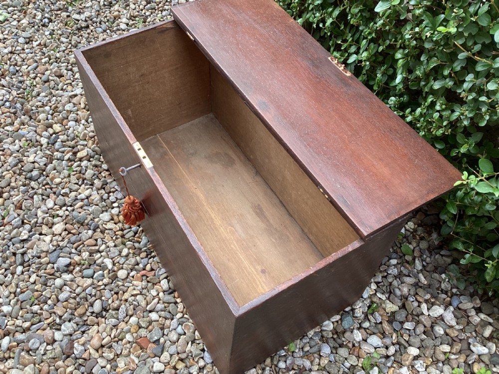 A rectangular dark mahogany wooden bible box featuring brass strap hinges on top and a keyhole with a decorative tassel on the front. View VII