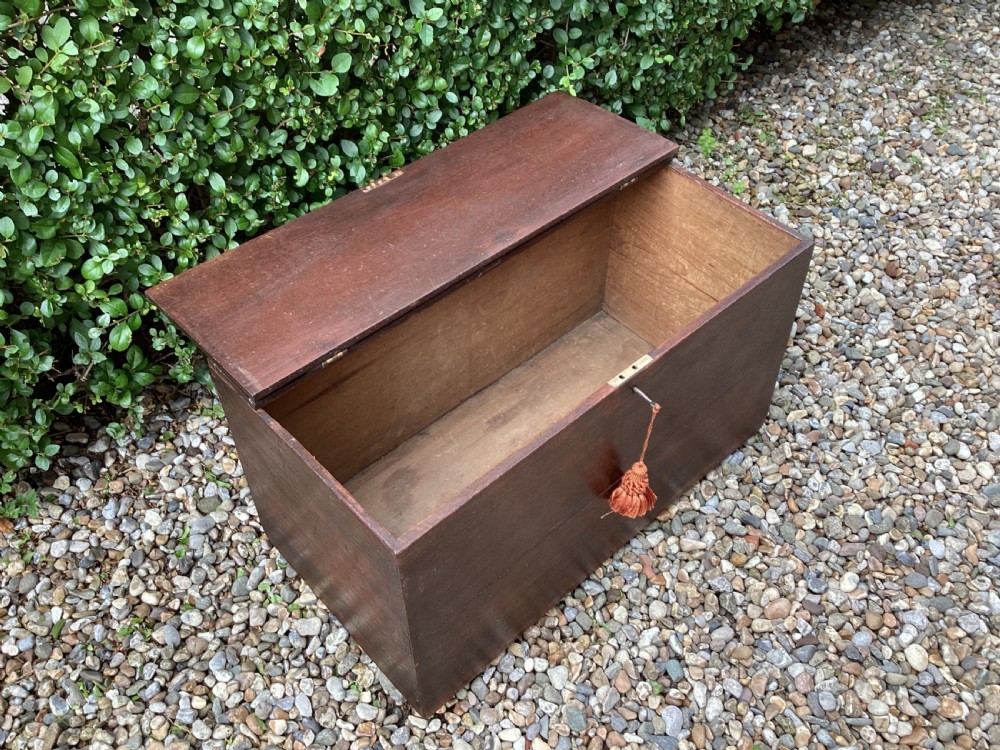 A rectangular dark mahogany wooden bible box featuring brass strap hinges on top and a keyhole with a decorative tassel on the front. View VIII