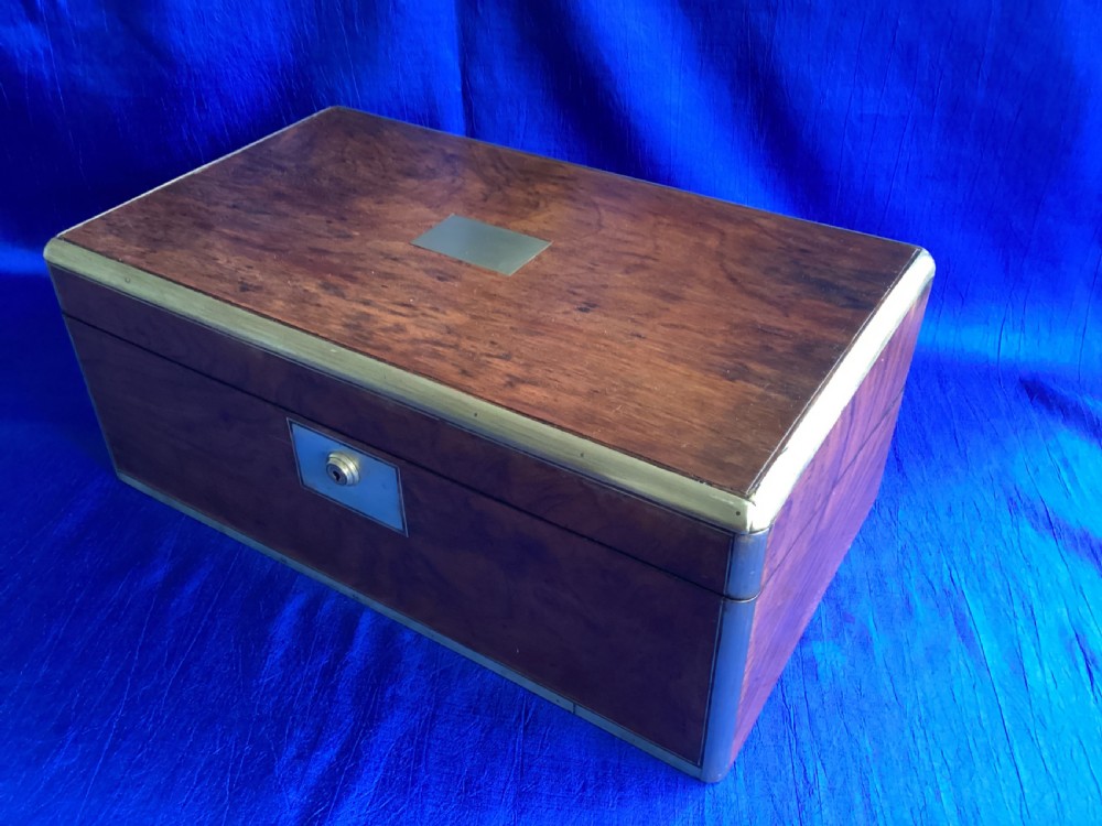 A rectangular Georgian mahogany writing slope featuring brass bound edges, flush corner fittings, and a central brass keyhole plate. View III