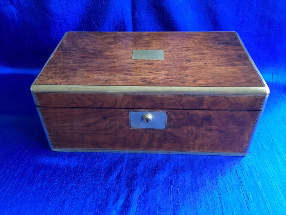 A rectangular Georgian mahogany writing slope featuring brass bound edges, flush corner fittings, and a central brass keyhole plate. View IV