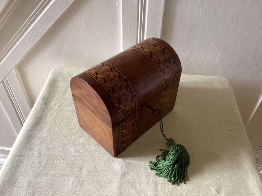 Victorian domed top parquetry and walnut tea caddy


 parquetry tea caddy View V