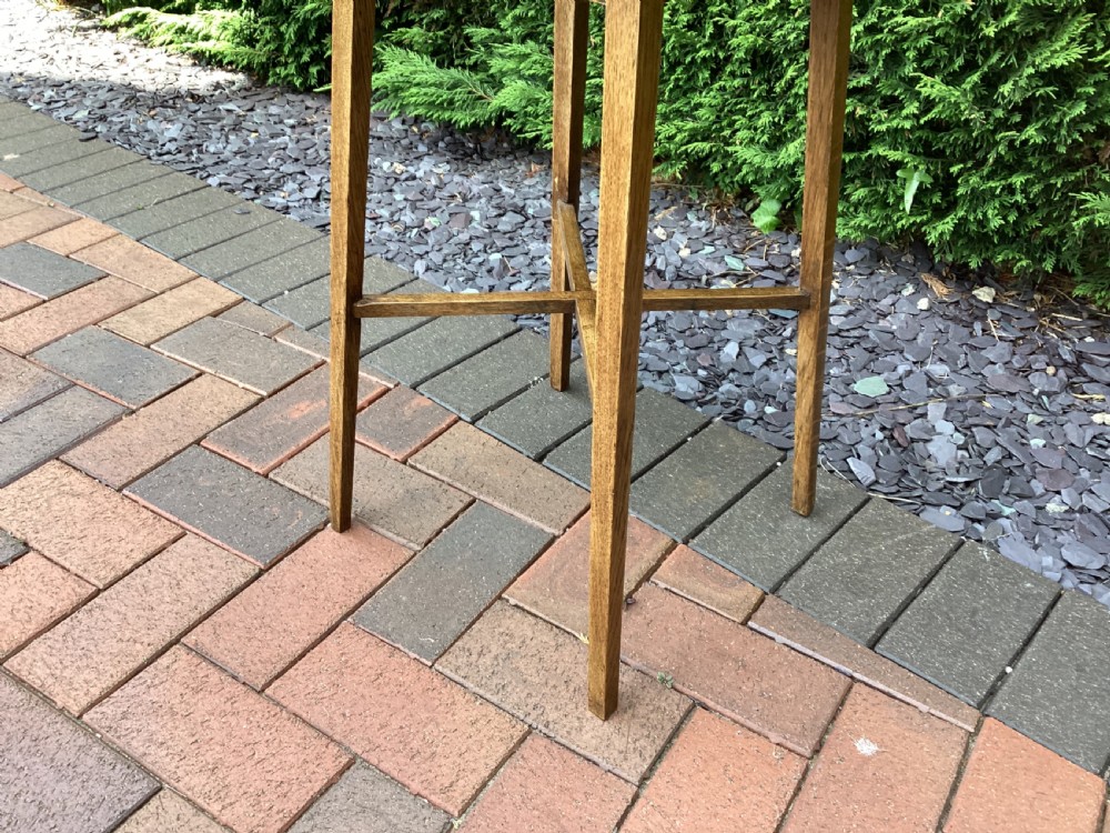 A rectangular solid oak Arts and Crafts side table featuring splayed tapered legs and an X-frame lower stretcher. View IV