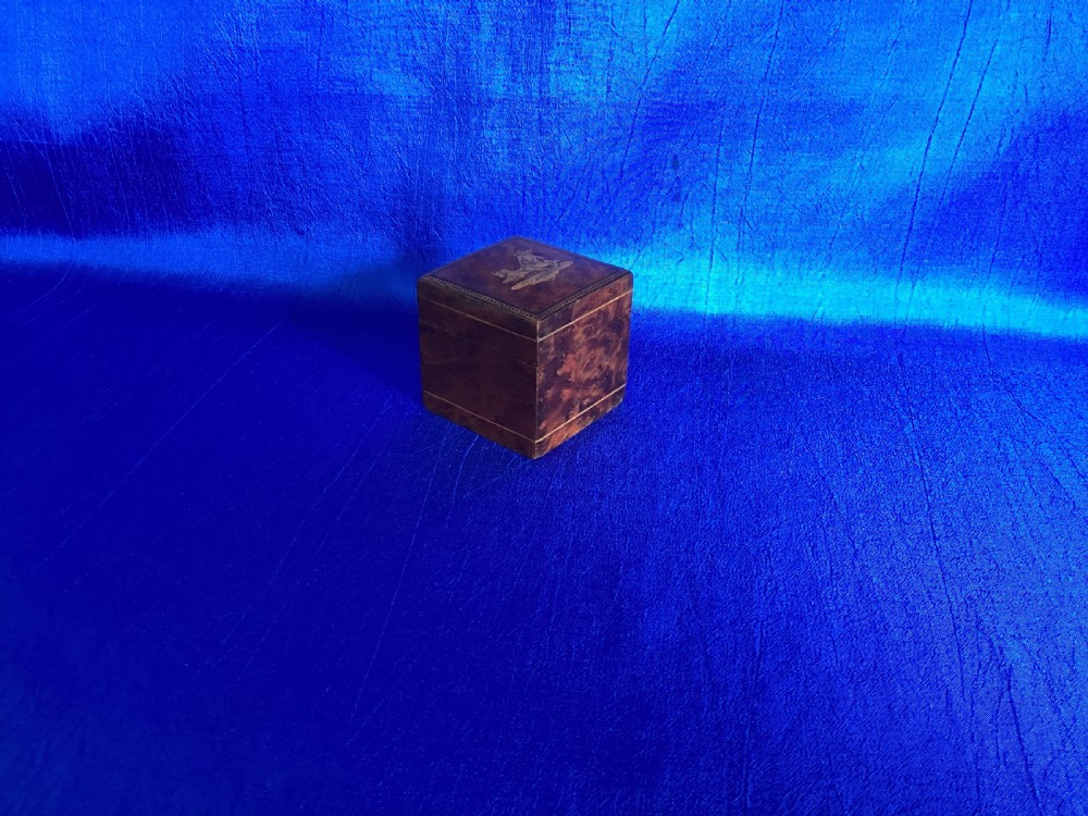A small square Victorian burr walnut travelling inkwell box featuring detailed mosaic wood inlay on the lid. View IV