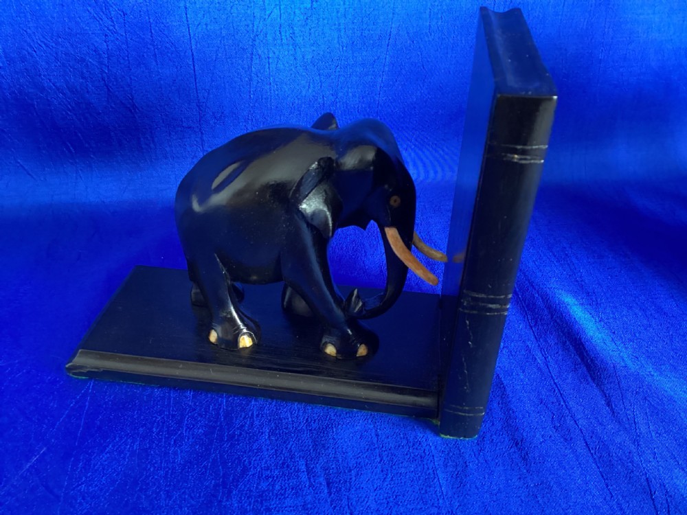 A pair of carved black ebony bookends shaped as elephants with bone tusks and toes. View II