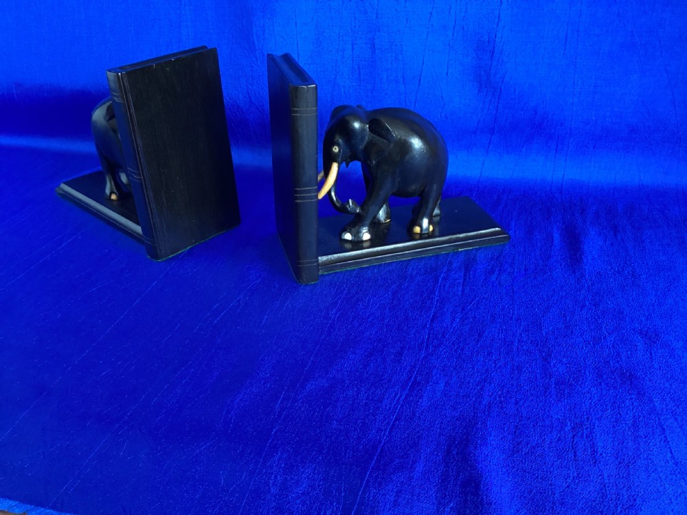 A pair of carved black ebony bookends shaped as elephants with bone tusks and toes. View VII