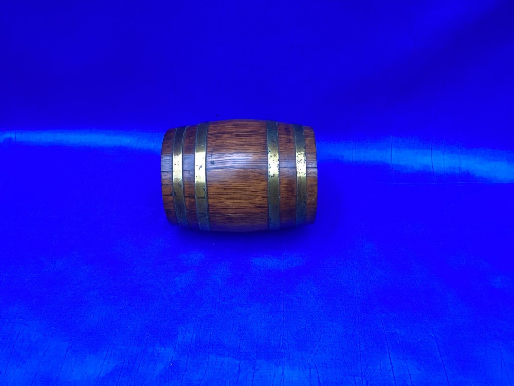 An Edwardian oak coopered barrel money box View III