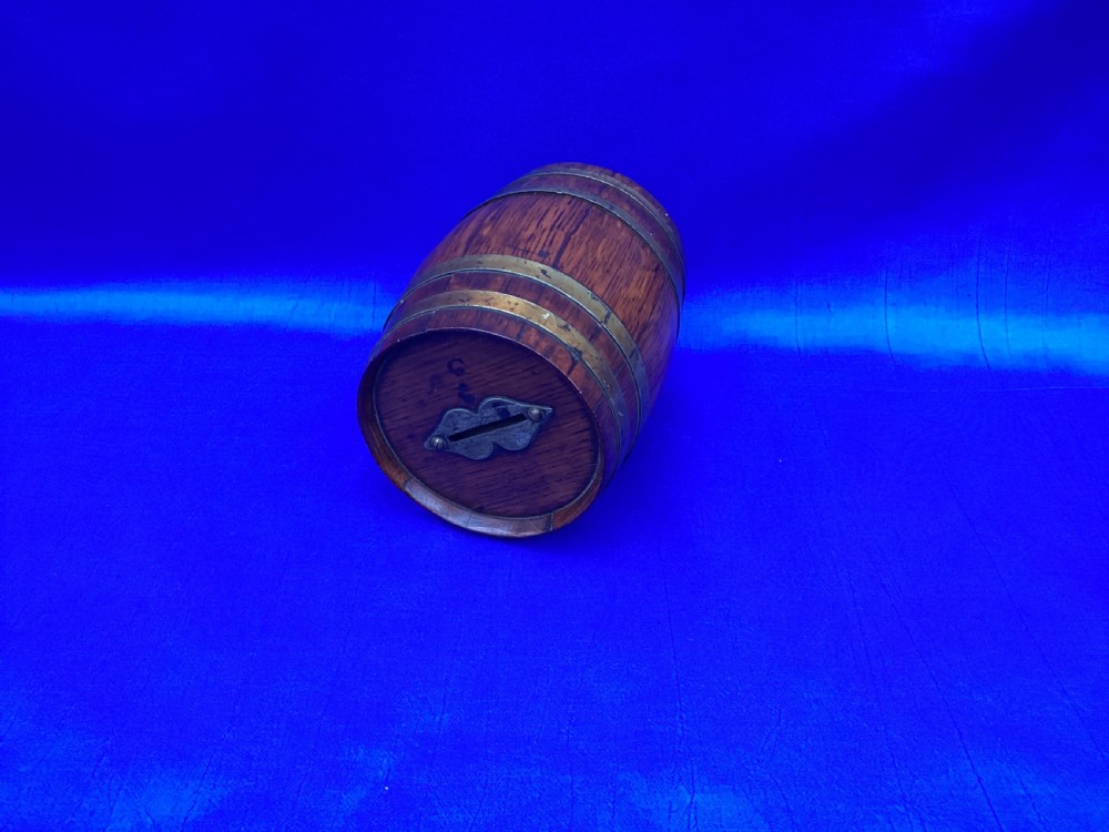 An Edwardian oak coopered barrel money box View IV