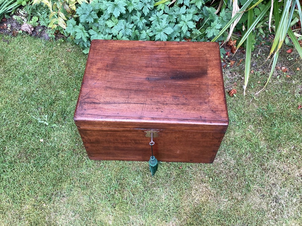 A rectangular Victorian mahogany deed box featuring a hinged lid, polished wood grain, and a central brass escutcheon with an inserted key. View II