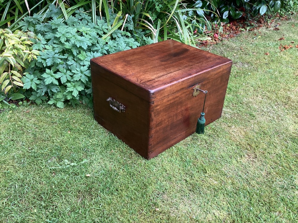 A rectangular Victorian mahogany deed box featuring a hinged lid, polished wood grain, and a central brass escutcheon with an inserted key. View III