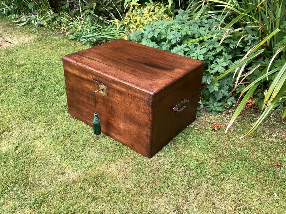 A rectangular Victorian mahogany deed box featuring a hinged lid, polished wood grain, and a central brass escutcheon with an inserted key. View IV