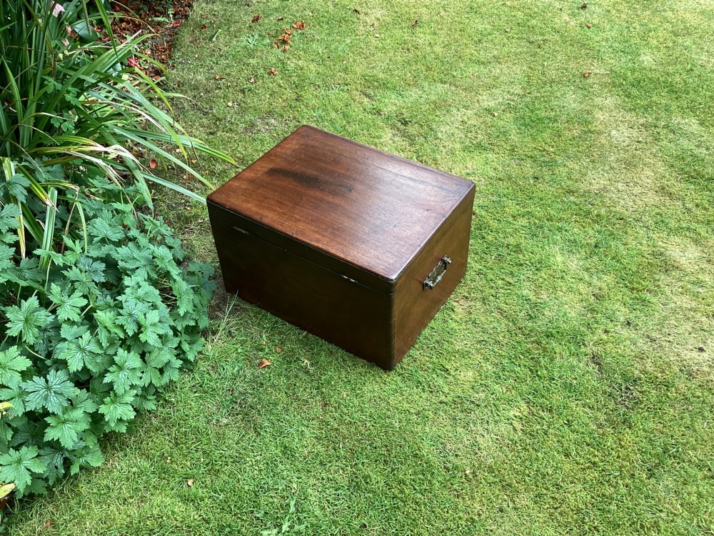 A rectangular Victorian mahogany deed box featuring a hinged lid, polished wood grain, and a central brass escutcheon with an inserted key. View VII