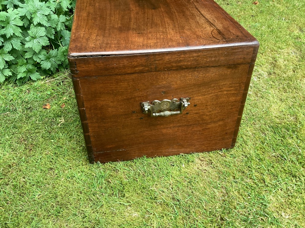 A rectangular Victorian mahogany deed box featuring a hinged lid, polished wood grain, and a central brass escutcheon with an inserted key. View VIII