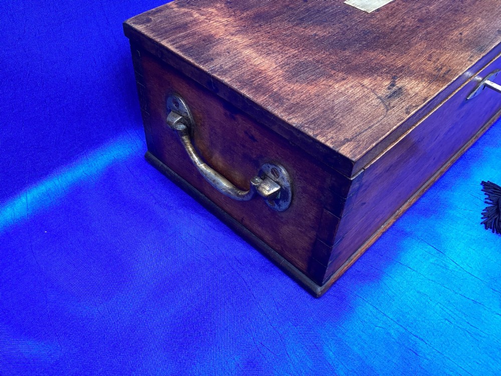 A rectangular Georgian mahogany tool box featuring a hinged lid with a central brass inlay plaque, a keyhole with a brass escutcheon, and visible dovetail joinery. View III