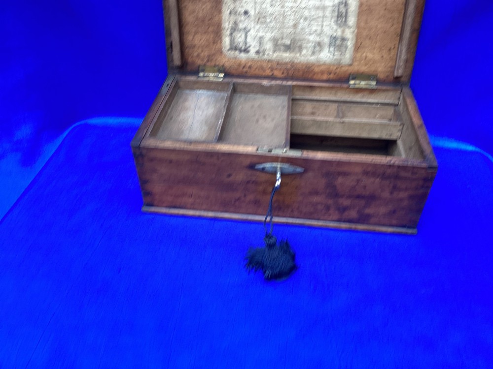 A rectangular Georgian mahogany tool box featuring a hinged lid with a central brass inlay plaque, a keyhole with a brass escutcheon, and visible dovetail joinery. View IX