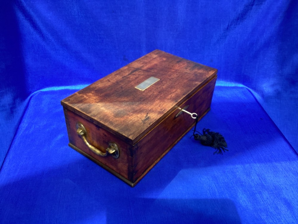 A rectangular Georgian mahogany tool box featuring a hinged lid with a central brass inlay plaque, a keyhole with a brass escutcheon, and visible dovetail joinery. View X