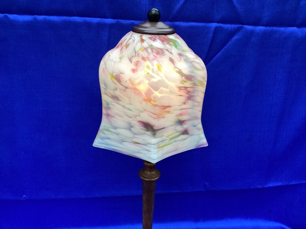 An antique turned oak table lamp featuring a bell-shaped variegated spatter glass shade and a yellow fabric-covered cable. View VI