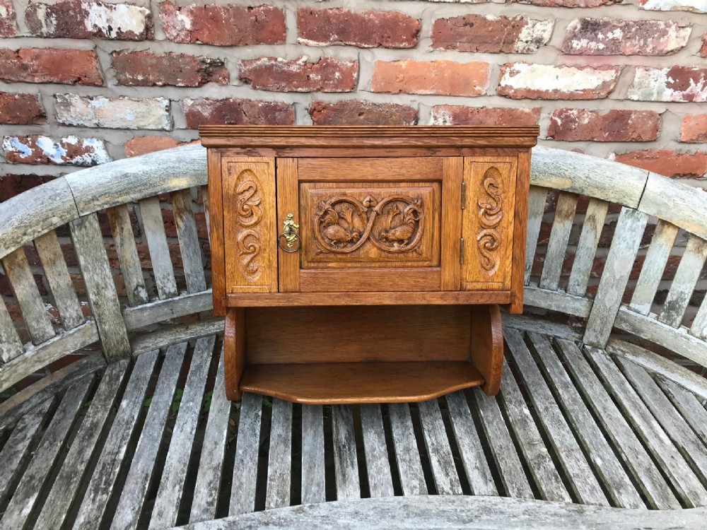 Victorian oak carved wall cupboard
