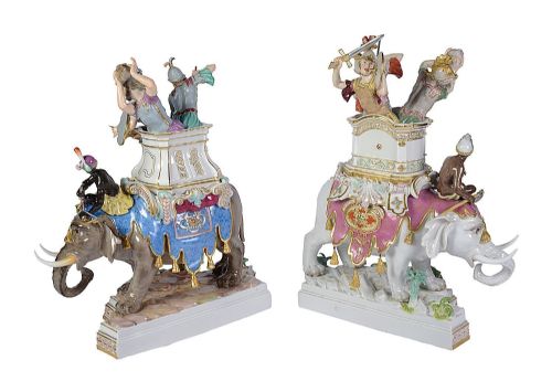 fig 3. A pair of elaborate 19th-century Meissen porcelain sculptures depicting war elephants with armed soldiers and attendants on gilded bases.
