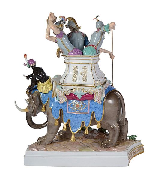 fig 4. A pair of elaborate 19th-century Meissen porcelain sculptures depicting war elephants with armed soldiers and attendants on gilded bases.