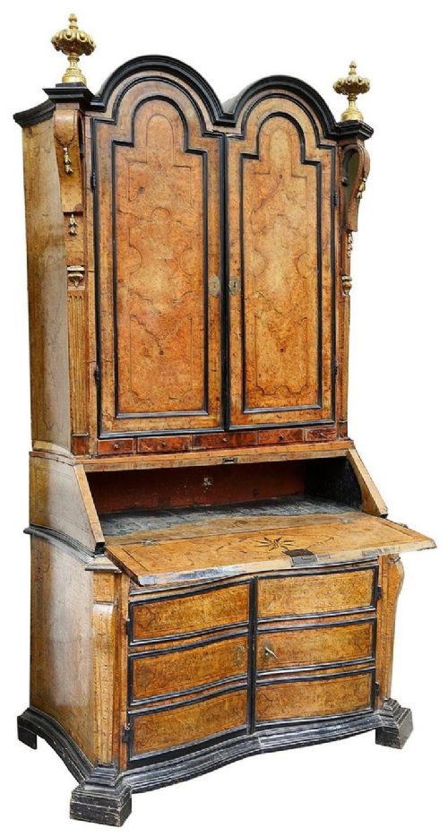 fig 1. A pair of 18th-century Italian burr walnut double dome bureau bookcases with ebonised mouldings and gilded finials.
