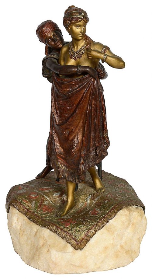 Cold painted bronze sculpture depicting a semi-nude woman and an attendant standing upon a carpet-patterned surface mounted on an alabaster base. View VII
