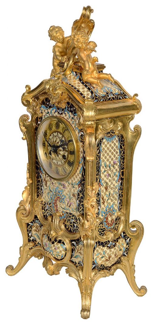 A 19th-century French Louis XVI style gilt bronze mantel clock decorated with multi-coloured enamel scrollwork and topped with twin cherub figures. View VIII