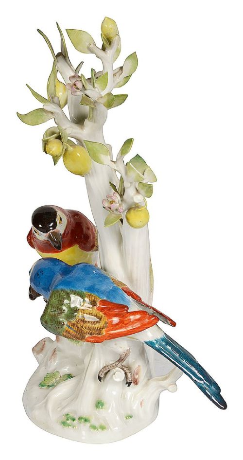 A 19th-century Meissen porcelain sculpture featuring two colourful parrots perched beneath a lemon tree with yellow fruit and green leaves. View III