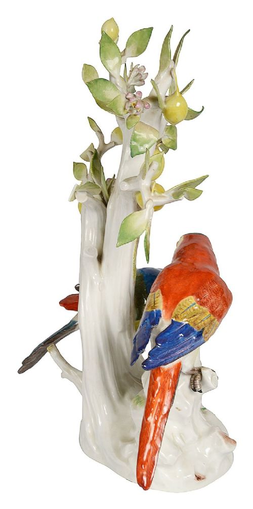 A 19th-century Meissen porcelain sculpture featuring two colourful parrots perched beneath a lemon tree with yellow fruit and green leaves. View V