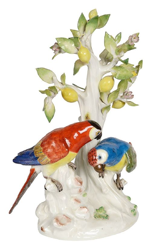 A 19th-century Meissen porcelain sculpture featuring two colourful parrots perched beneath a lemon tree with yellow fruit and green leaves. View VI