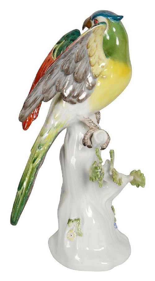 A late 19th-century Meissen hard-paste porcelain figurine depicting a brightly enamelled parrot perched on a tree stump base. View V
