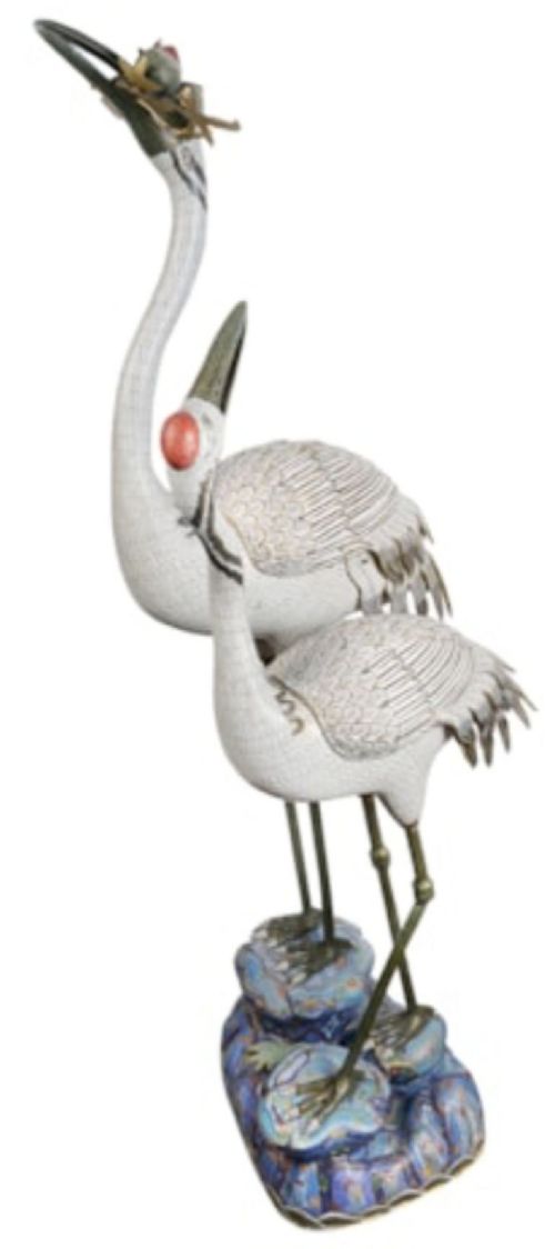 A pair of Chinese cloisonne crane sculptures crafted with white enamel bodies standing on patterned blue bases. View II