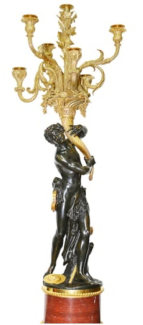 A pair of French Louis XVI style bronze candelabra featuring dark patinated classical figures holding scrolling multi-light gilt bronze candle branches, elevated on red marble bases. View II