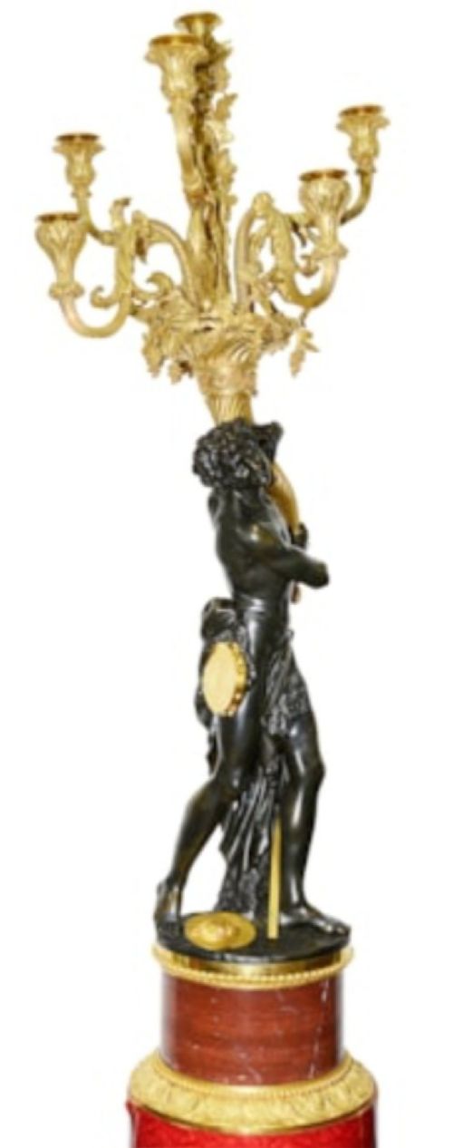 A pair of French Louis XVI style bronze candelabra featuring dark patinated classical figures holding scrolling multi-light gilt bronze candle branches, elevated on red marble bases. View V