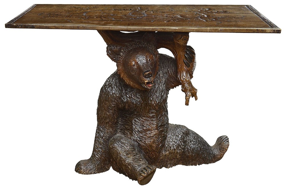 A rare lareg 19th Century Black Forest carved Lindenwood table.
