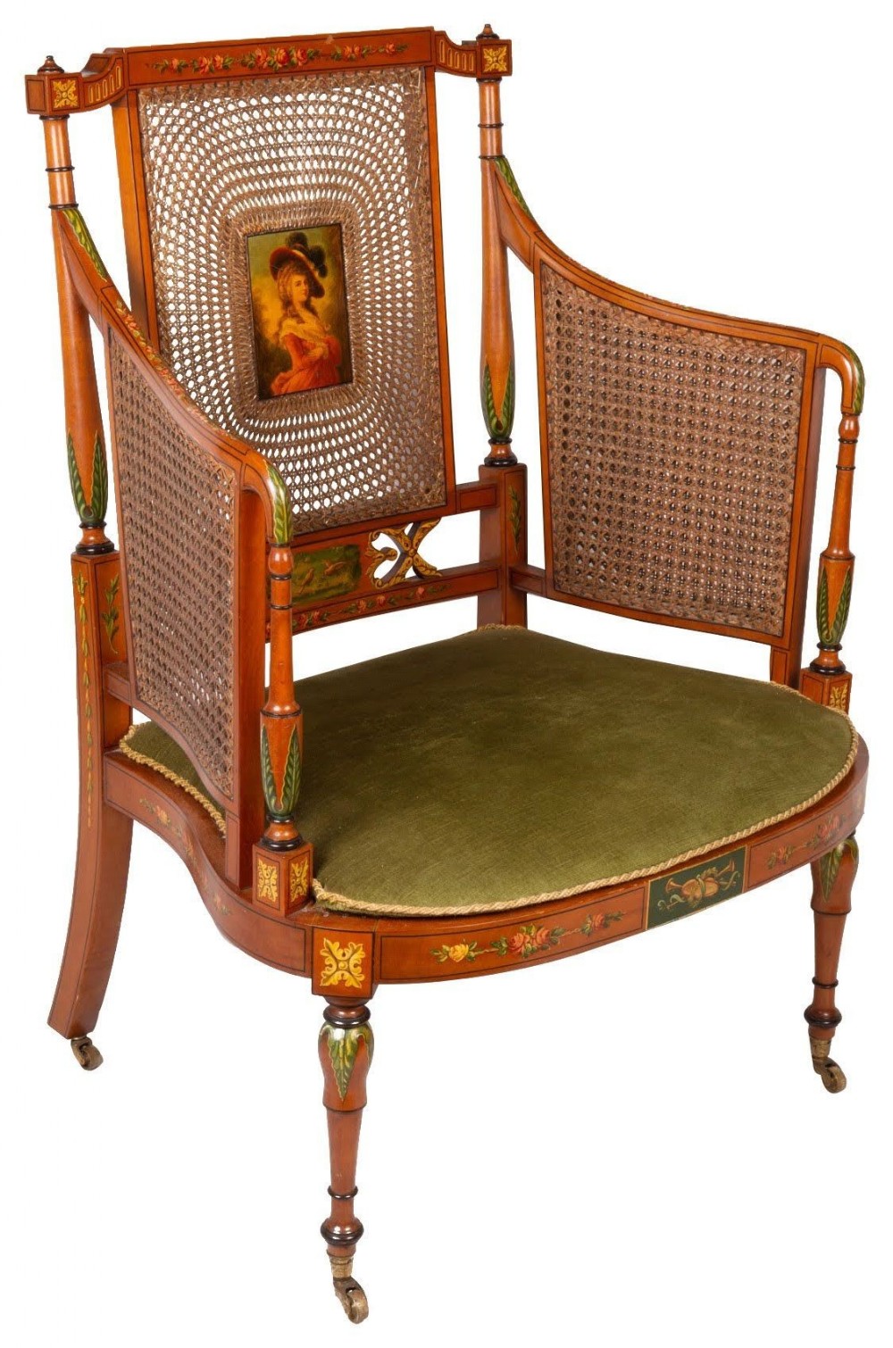 A late 19th-century painted satinwood bergere armchair featuring woven cane back and sides, a painted female portrait medallion, green velvet seat, and turned legs on brass castors.