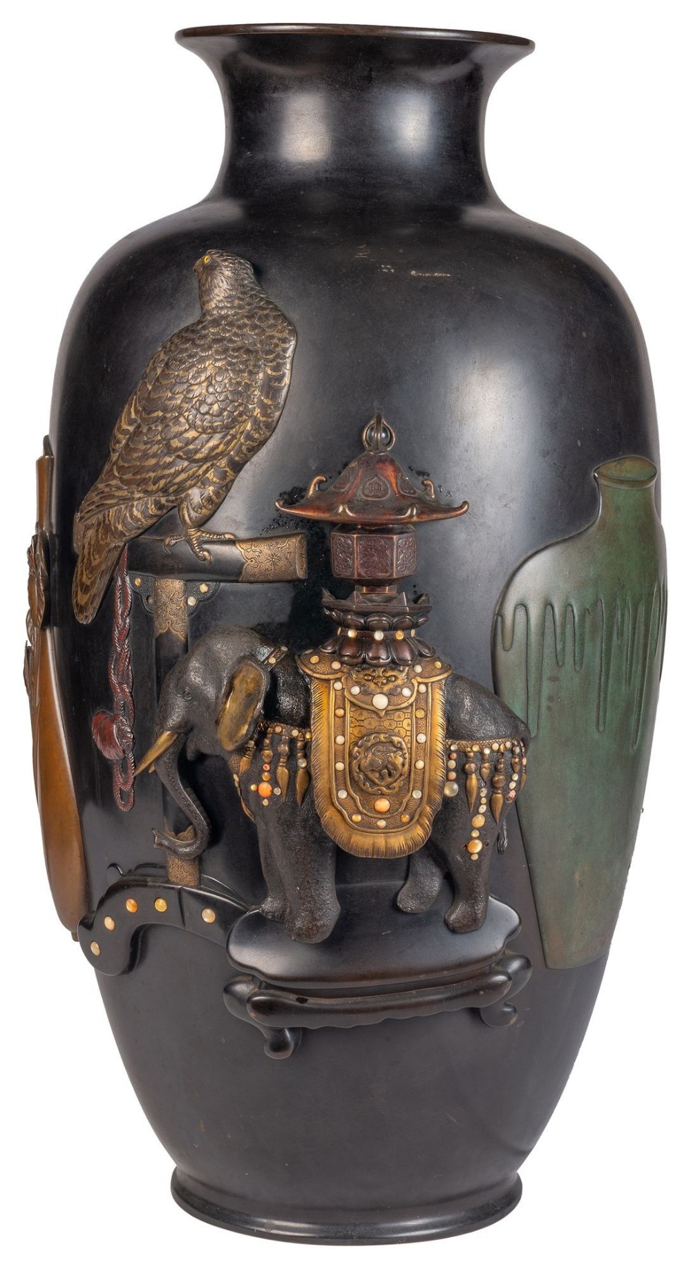 A dark bronze Japanese vase featuring high-relief mixed metal ornamentation of a hawk and a ceremonial elephant.