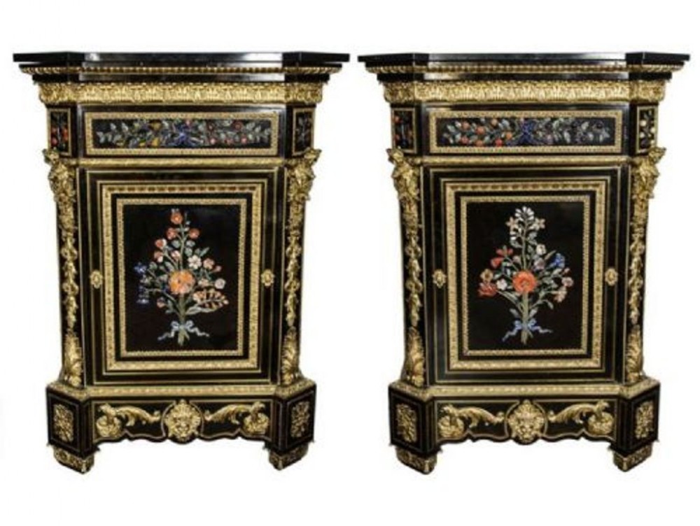 A matching pair of 19th-century ebonised side cabinets decorated with gilt-bronze mounts and central panels featuring floral pietra dura stone inlays.