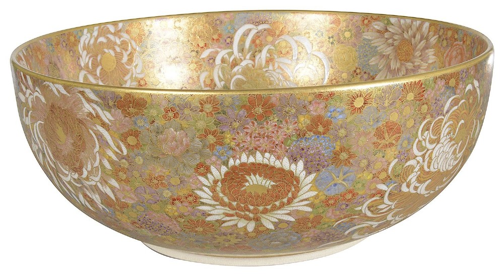 A round Japanese Satsuma earthenware bowl densely decorated inside and out with a millefleur floral pattern in polychrome enamels and gold gilding.