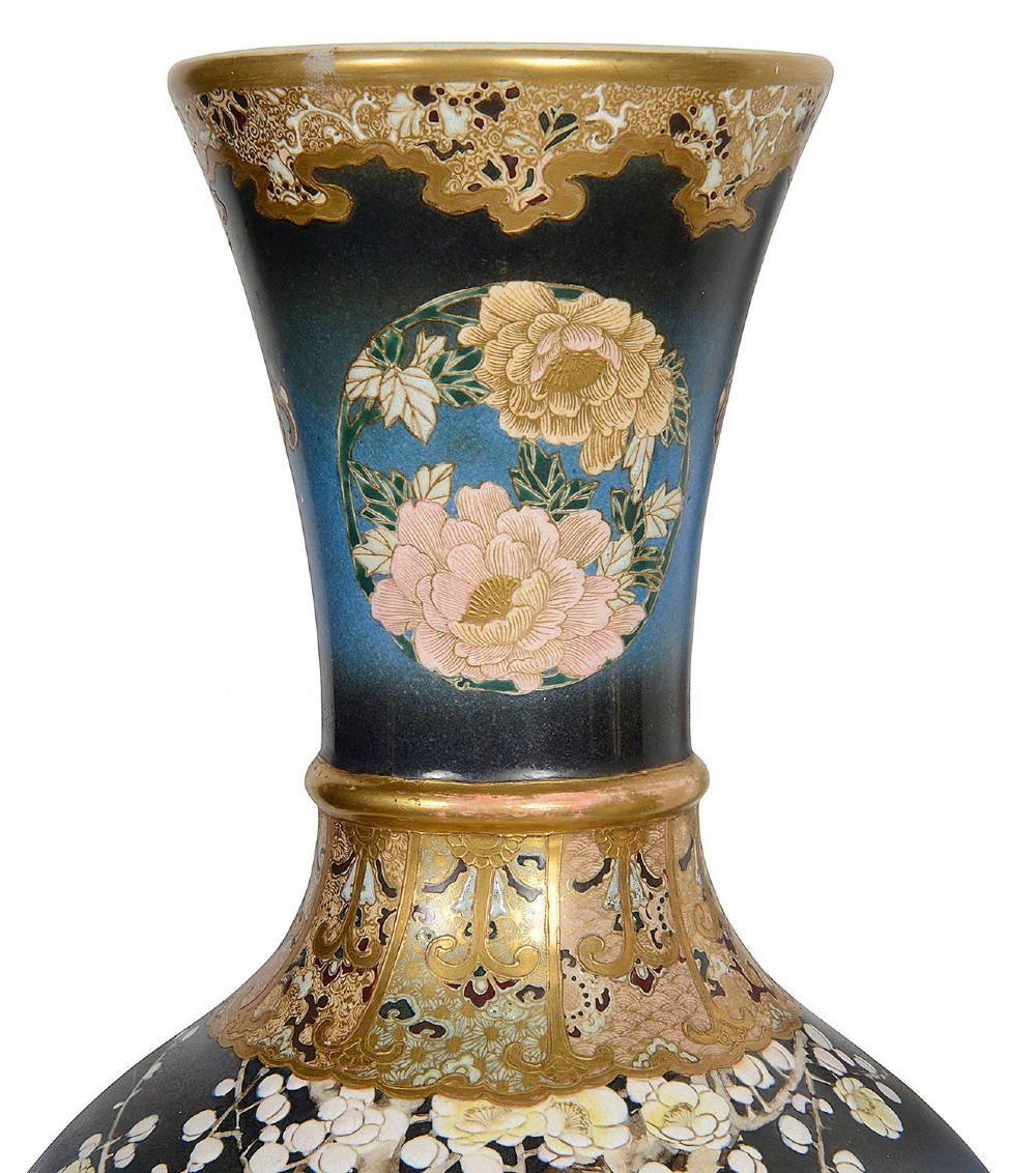 A pair of tall Japanese Satsuma baluster vases featuring gradient blue grounds decorated with hand-painted blossom trees and gilt geometric borders. View V