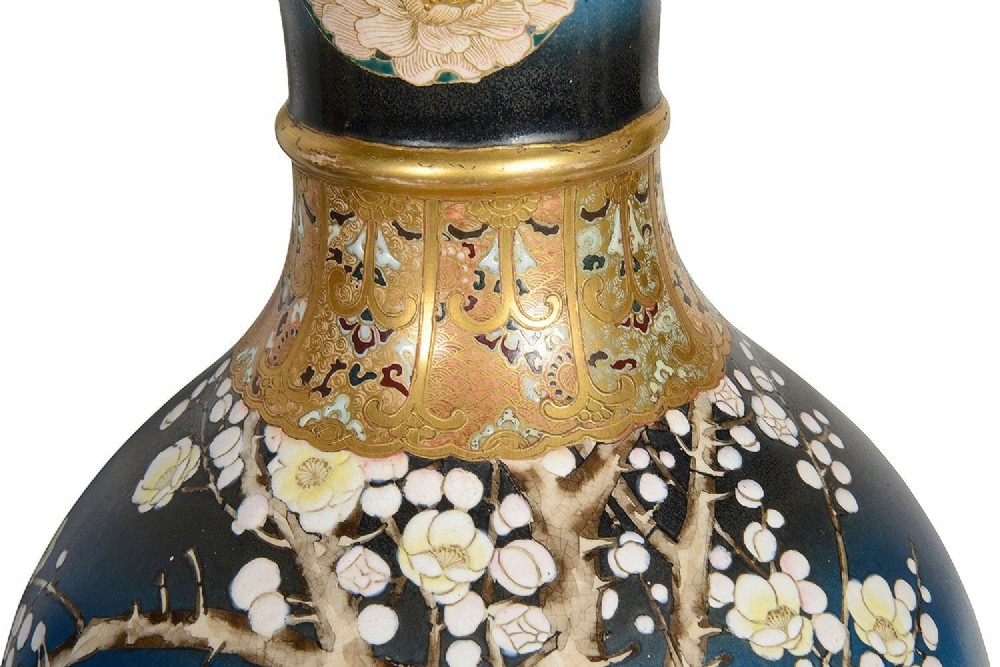 A pair of tall Japanese Satsuma baluster vases featuring gradient blue grounds decorated with hand-painted blossom trees and gilt geometric borders. View VI
