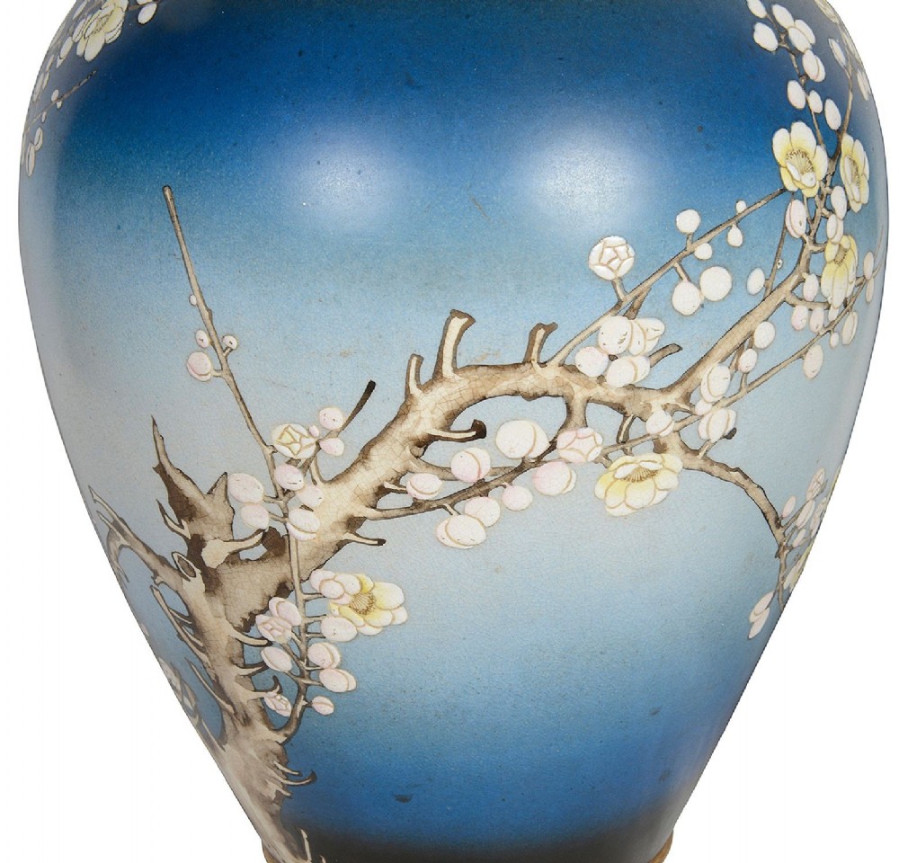 A pair of tall Japanese Satsuma baluster vases featuring gradient blue grounds decorated with hand-painted blossom trees and gilt geometric borders. View VII
