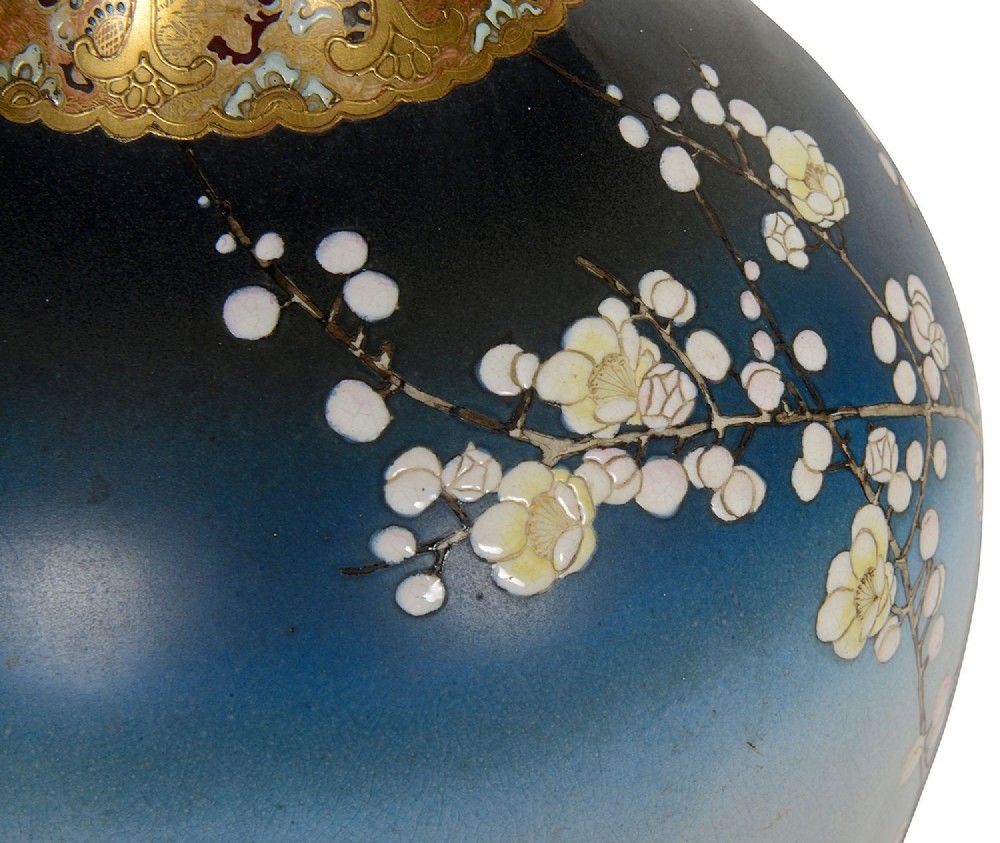 A pair of tall Japanese Satsuma baluster vases featuring gradient blue grounds decorated with hand-painted blossom trees and gilt geometric borders. View VIII