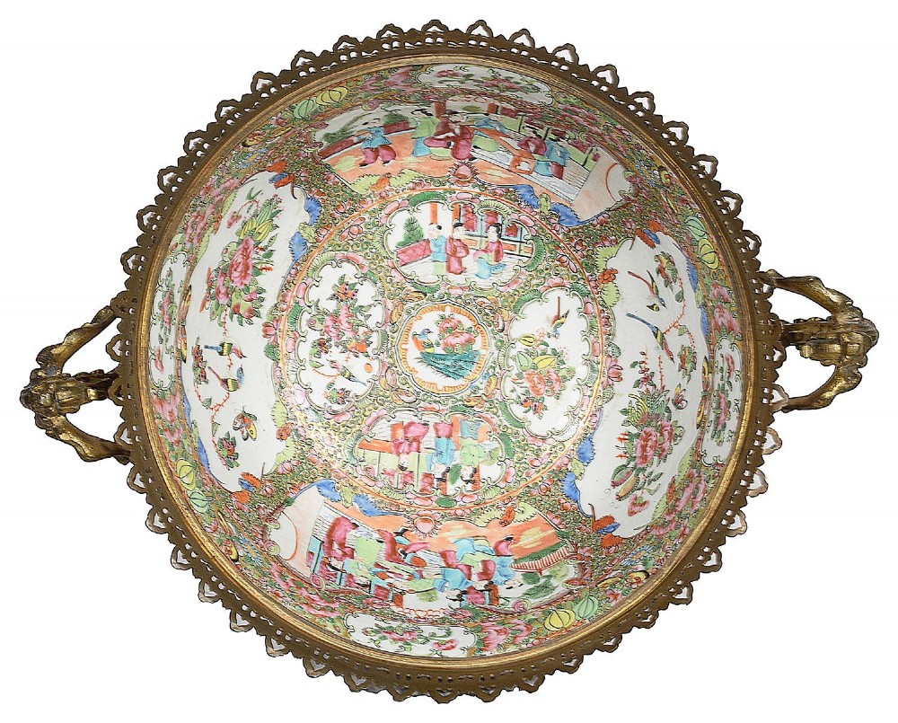 A nineteenth-century Cantonese Rose Medallion porcelain bowl held within ornate gilt-bronze ormolu mounts featuring mythical beast handles and a pierced base. View V