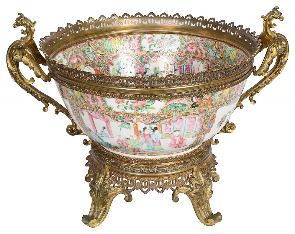 A nineteenth-century Cantonese Rose Medallion porcelain bowl held within ornate gilt-bronze ormolu mounts featuring mythical beast handles and a pierced base. View VII