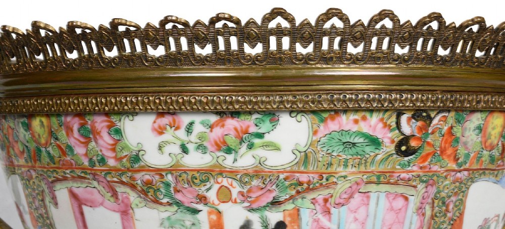 A nineteenth-century Cantonese Rose Medallion porcelain bowl held within ornate gilt-bronze ormolu mounts featuring mythical beast handles and a pierced base. View IX